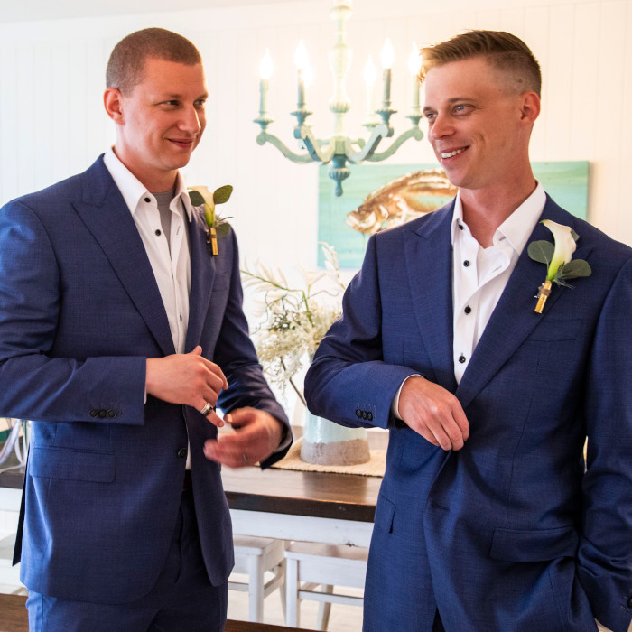 two men wearing hartter manly suits