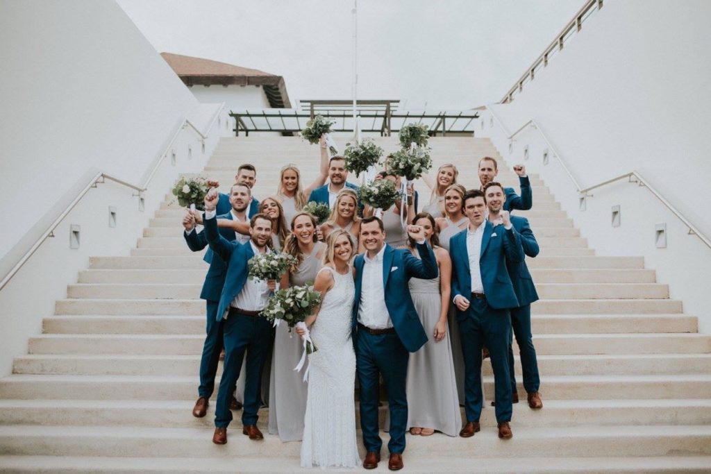 Wedding party posing on stairs