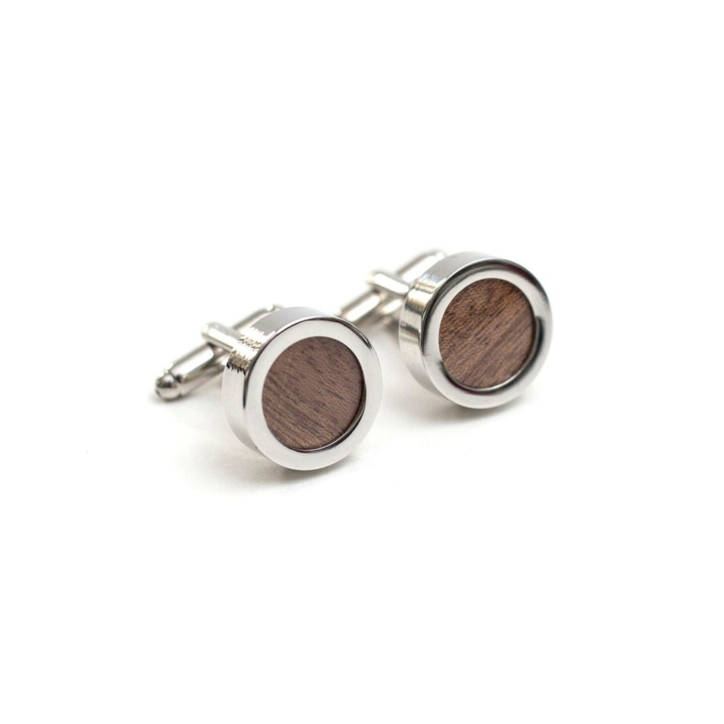 Silver and walnut wood round cufflinks on a white background